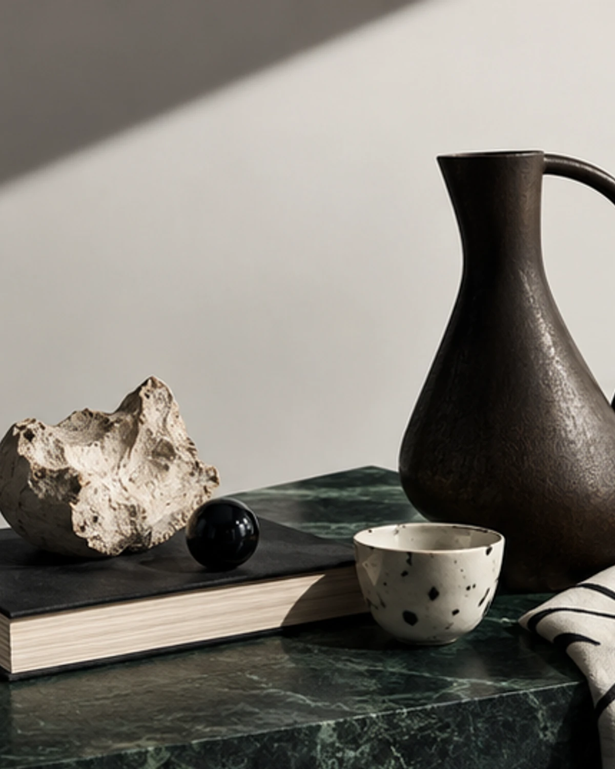 An object-led editorial still life for “Gifts for the Interior Design Person Who Can Spot a Bad Lamp.”